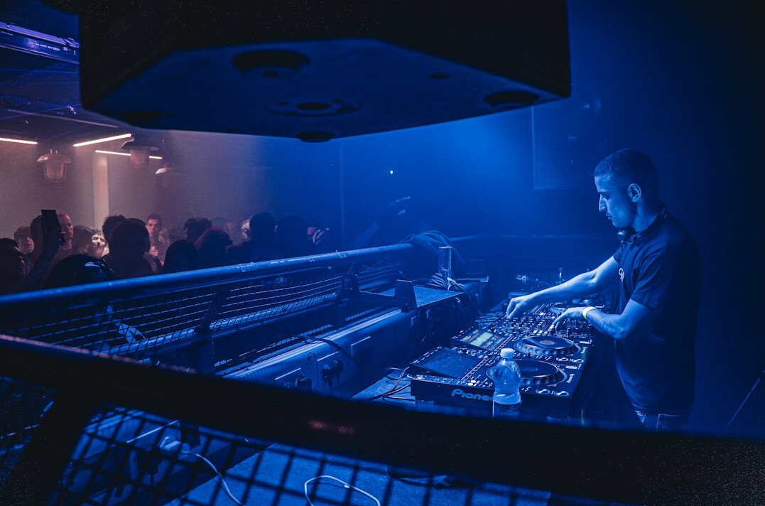 Technical director working at a broadcast control room switcher